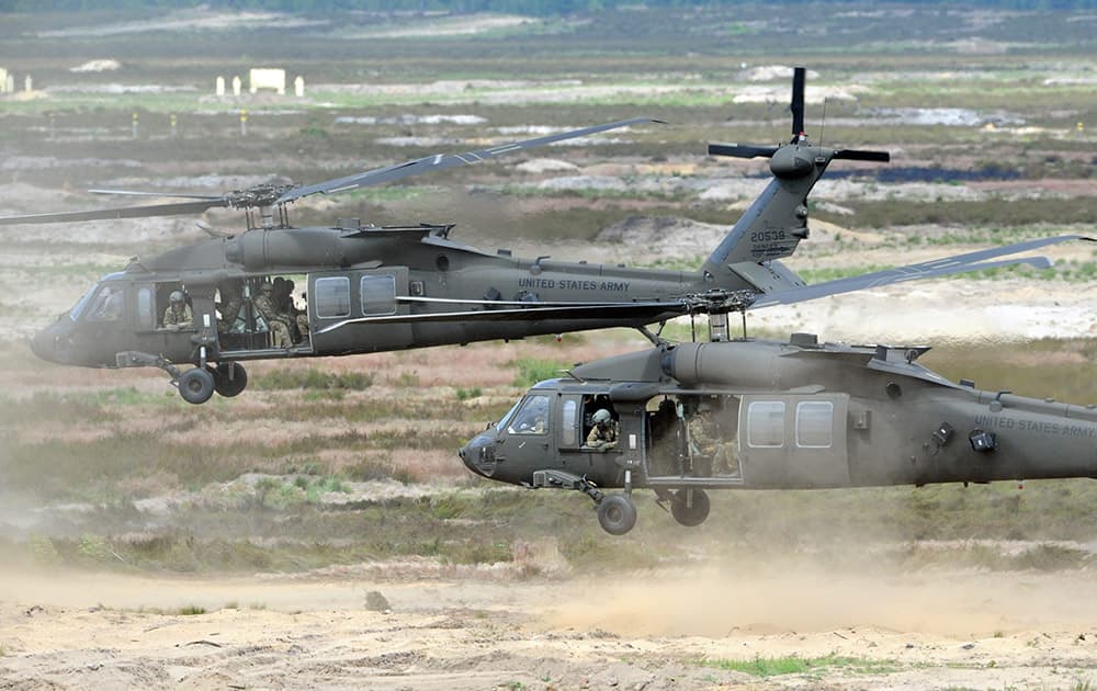 US Army helicopters transport soldiers during the NATO Noble Jump exercise on a training range near Swietoszow Zagan, Poland.