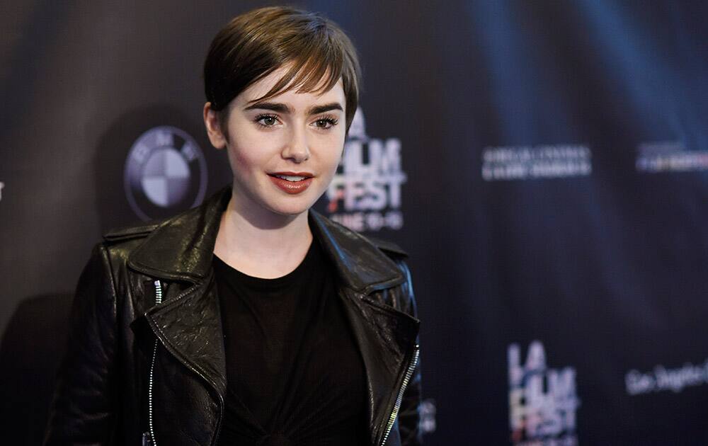 Lily Collins, cast as the character Stacy Hamilton for a live reading of the 1982 film 'Fast Times at Ridgemont High,' poses on the closing night of the Los Angeles Film Festival.