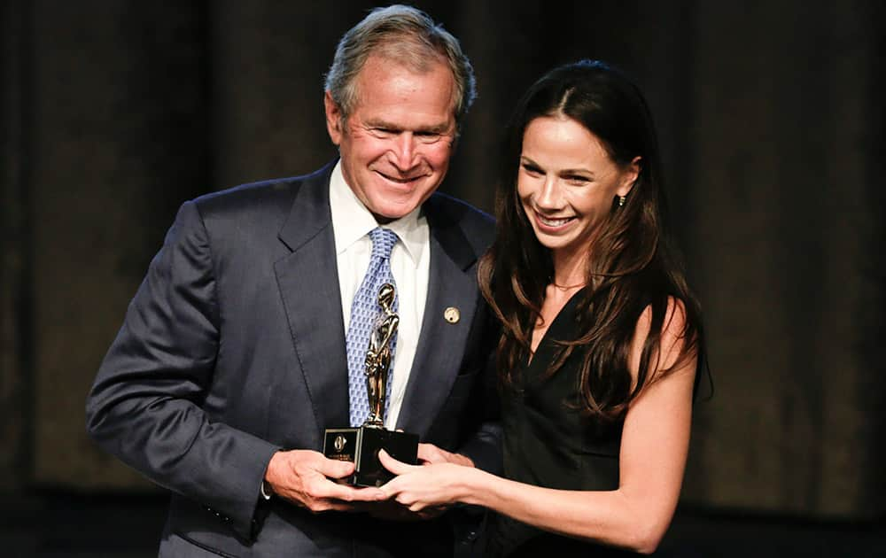 Former President George W. Bush, poses with his daughter, Barbara, after receiving an award at the 74th Annual Father of the Year Awards benefit luncheon.