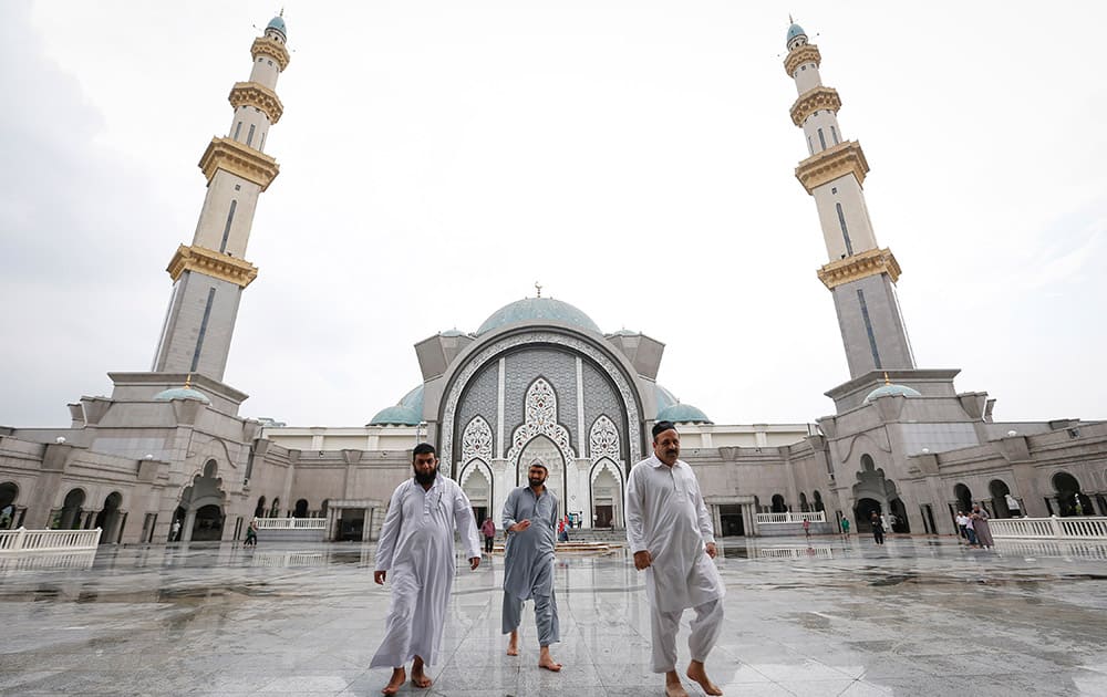 Muslims leave Wilayah Mosque after the Friday prayer during the holy Islamic month of Ramadan in Kuala Lumpur, Malaysia.