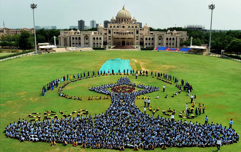 More than 700 students participate in a rehearsal for Yoga Day in Ahmedabad.