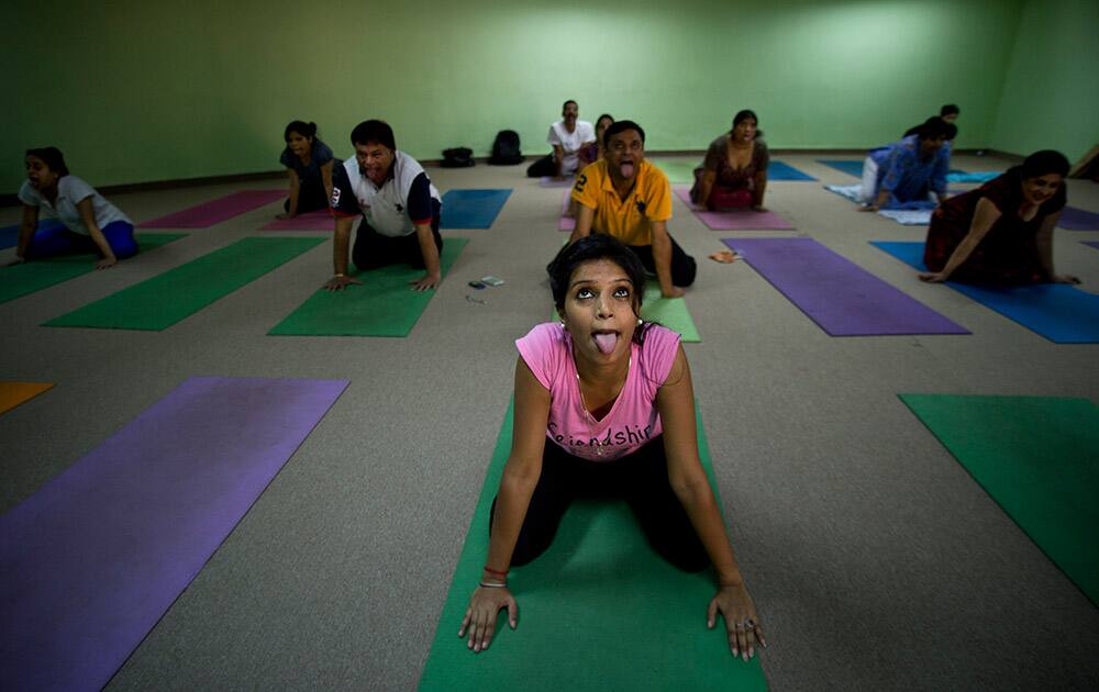 People perform yoga at the Morarji Desai National Institute of Yoga, in New Delhi.