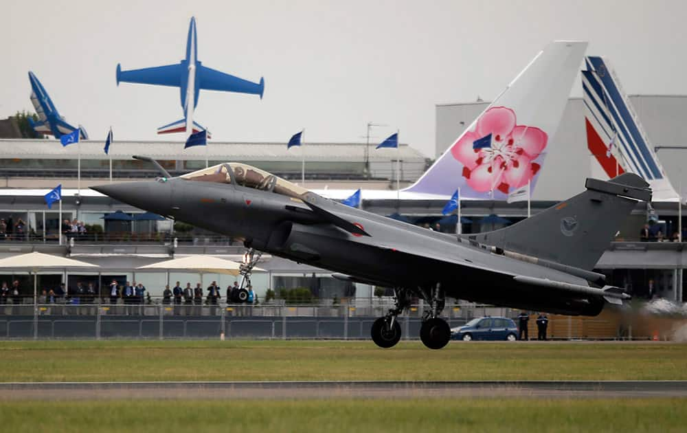 A Rafale jet aircraft lands after its demonstration flight at the Paris Air Show, in Le Bourget airport, north of Paris.