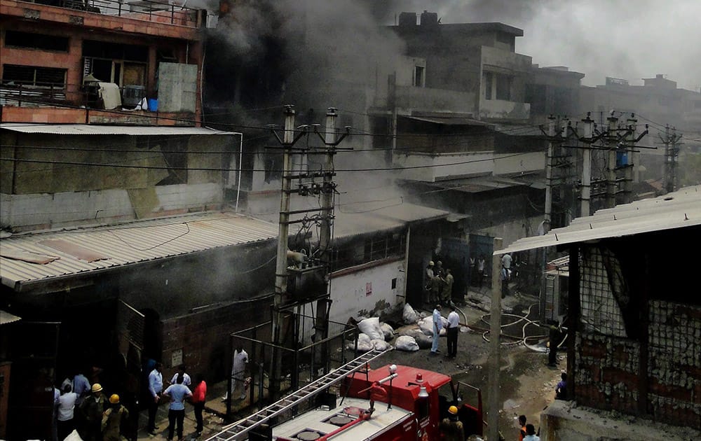 Smoke billowing out after a fire in Mangolpuri in New Delhi.