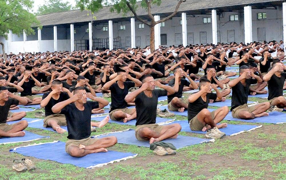 Army personnel participate in a rehearsal for International Yoga Day at Guards Regimental Centre near Nagpur.