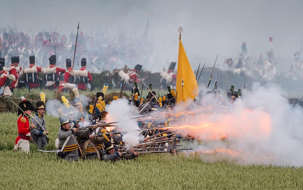 Re-enactors reconstruct 'The French Attack' as part of the commemoration of the bicentenary of the battle of Waterloo in Braine-l'Alleud, near Waterloo, Belgium.