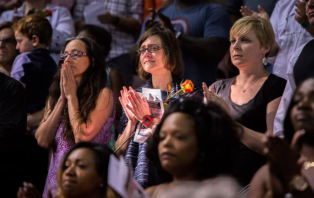 Mourners gather for a memorial service for the victims of a shooting Wednesday at Emanuel AME Church, in Charleston, S.C. Dylann Roof is accused of killing nine people inside the church.