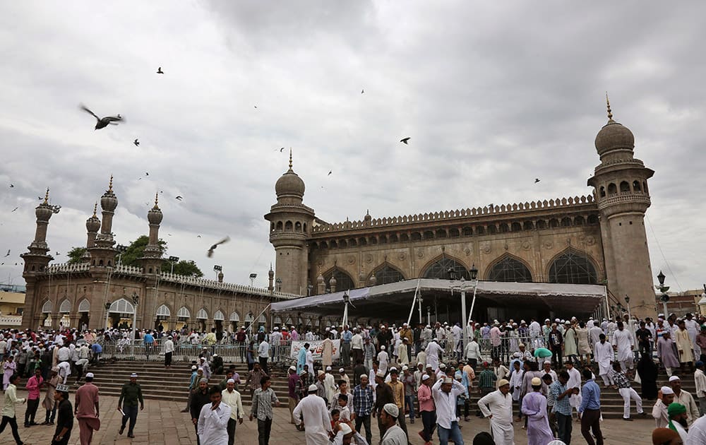 Muslims leave Mecca Mosque after the Friday prayers during the holy Islamic month of Ramadan in Hyderabad.