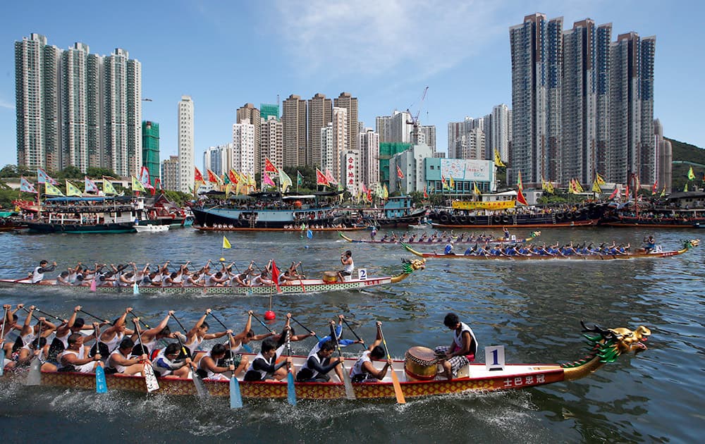 Participants compete in a dragon boat race in Hong Kong. The race is part of celebrations marking the Chinese Dragon Boat Festival, held throughout Hong Kong.