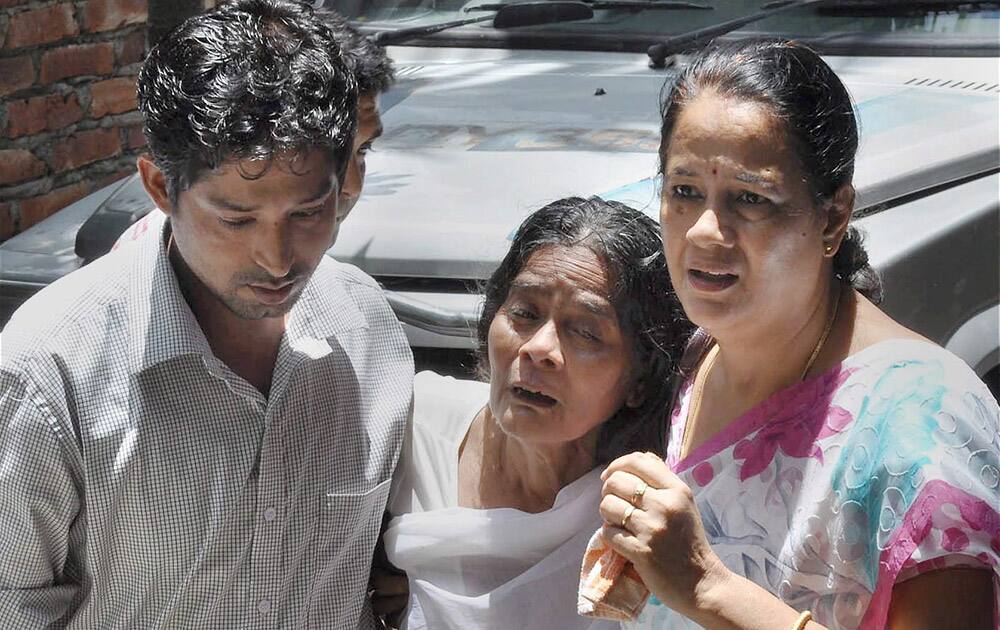 Mother of Priyanka Mahanta cries after she and her two daughters were allegedly murdered by her husband at Hatigaion in Guwahati.