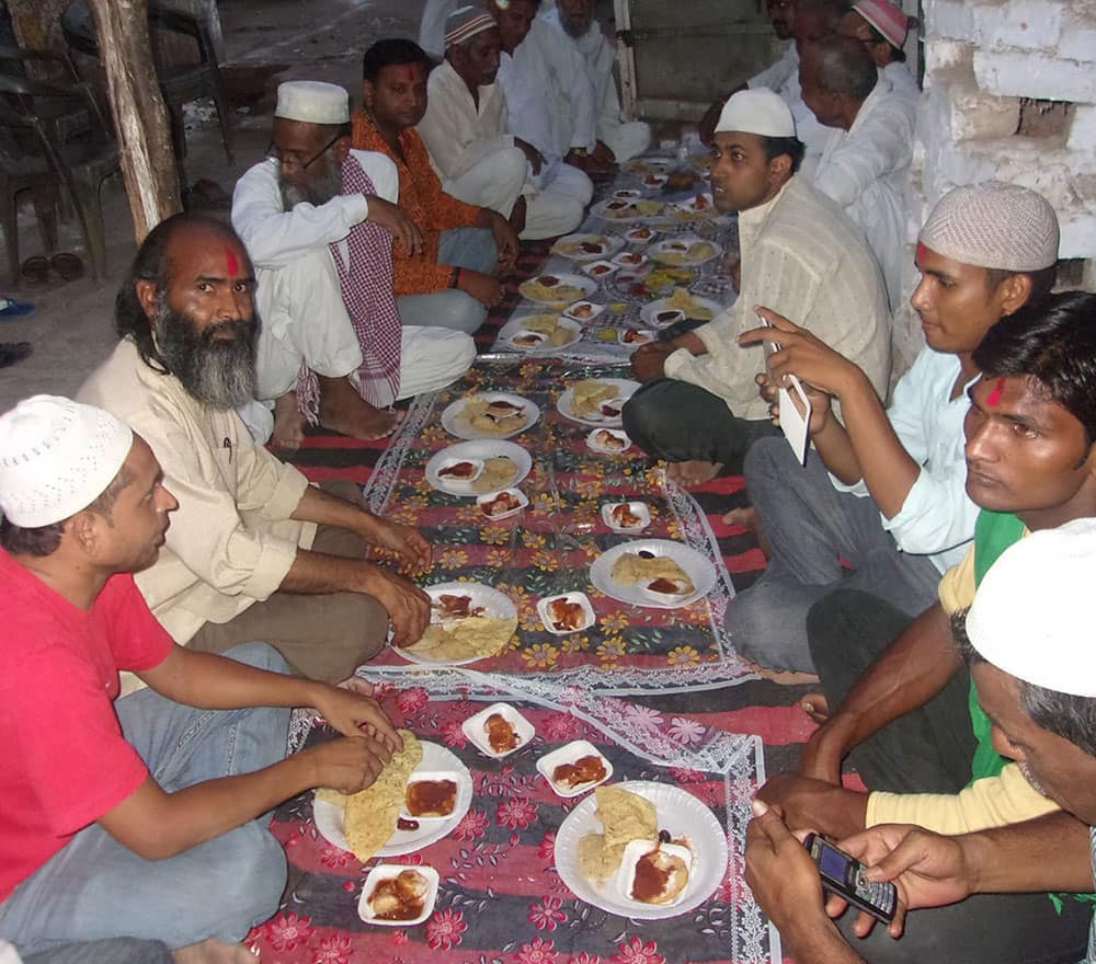 Hindus participate at roza iftar party in Mahoba district of Uttar Pradesh.
