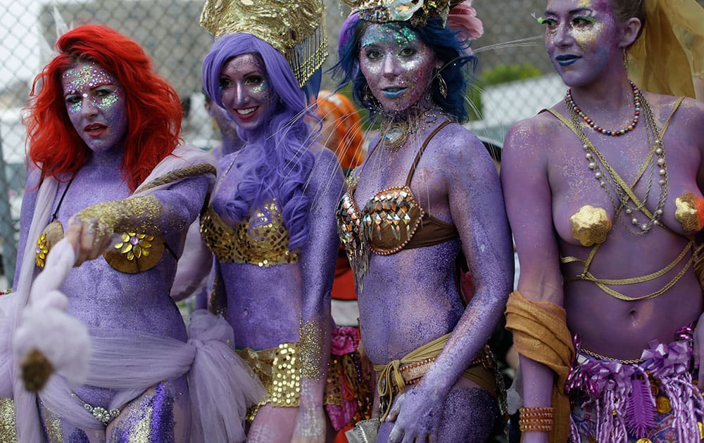 Tash's Mermaid Minions pose for photographers before the start of the 33rd annual Mermaid Parade, in Coney Island in the Brooklyn borough of New York.