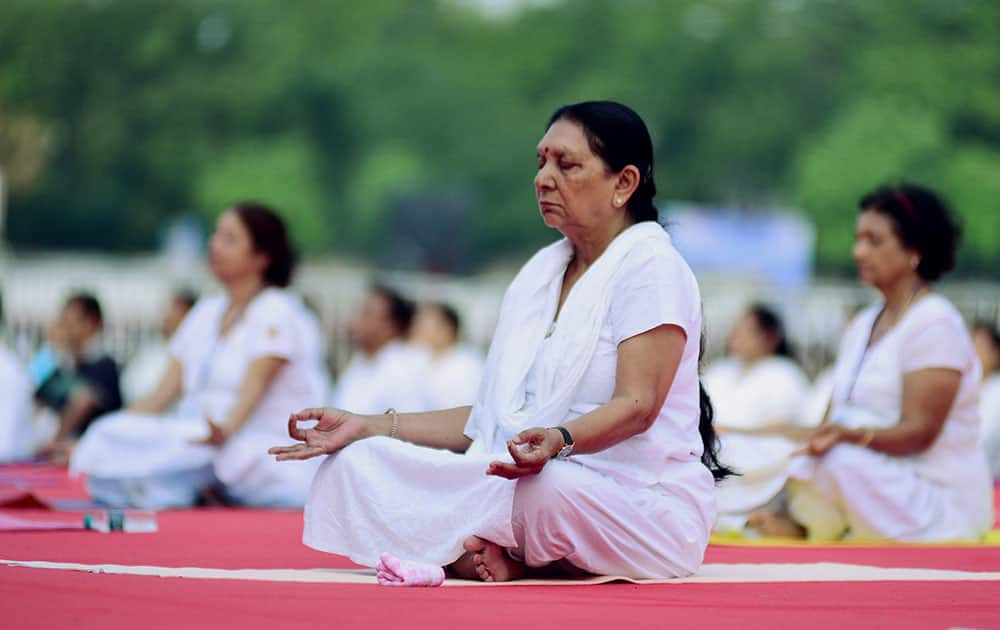 Gujarat Chief Minister Anandiben Patel performs Yoga during a mass yoga session on the International Day of Yoga 2015 at GMDC ground in Ahmedabad.