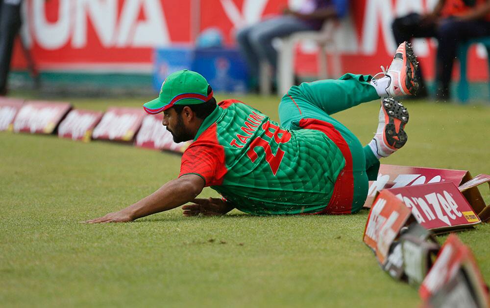 Bangladesh’s Tamim Iqbal drives to stop the ball as he fields against India during their second one-day international cricket match in Dhaka, Bangladesh.