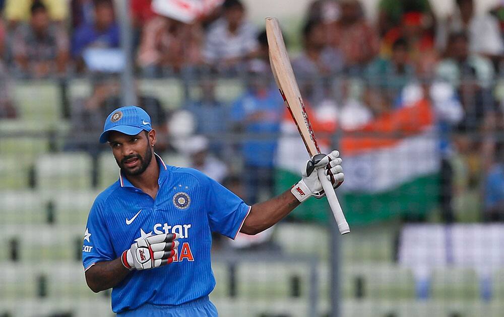 India’s Shikhar Dhawan acknowledges the crowd after scoring fifty runs during their second one-day international cricket match against Bangladesh in Dhaka, Bangladesh.