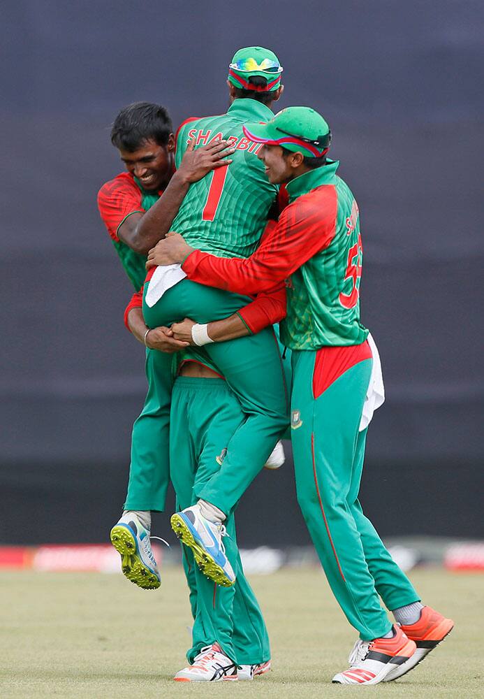 Bangladesh’s Rubel Hossain, left, celebrates with his teammates after the dismissal of India’s Ambati Rayudu during their second one-day international cricket match in Dhaka, Bangladesh.