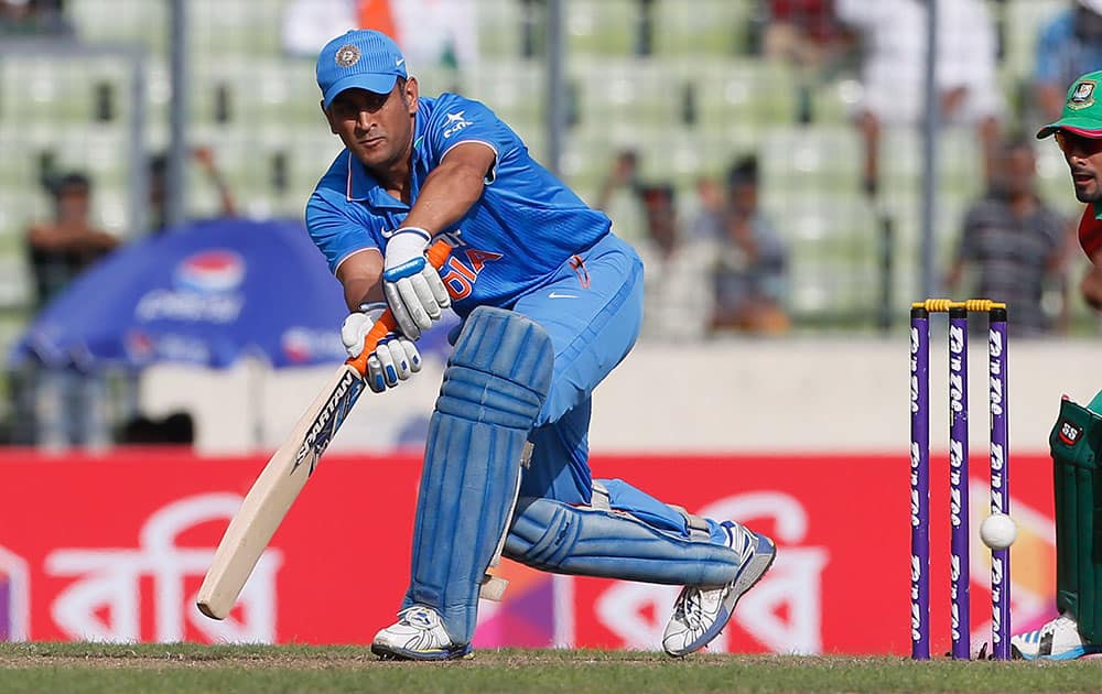 India’s captain M S Dhoni, plays a shot, during their second one-day international cricket match against Bangladesh in Dhaka, Bangladesh.