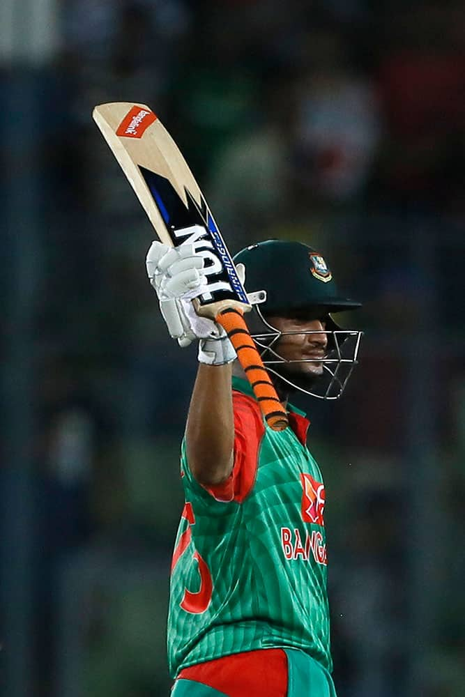 Bangladesh’s Shakib Al Hasan acknowledges the crowd after scoring fifty runs during their second one-day international cricket match against India in Dhaka, Bangladesh.