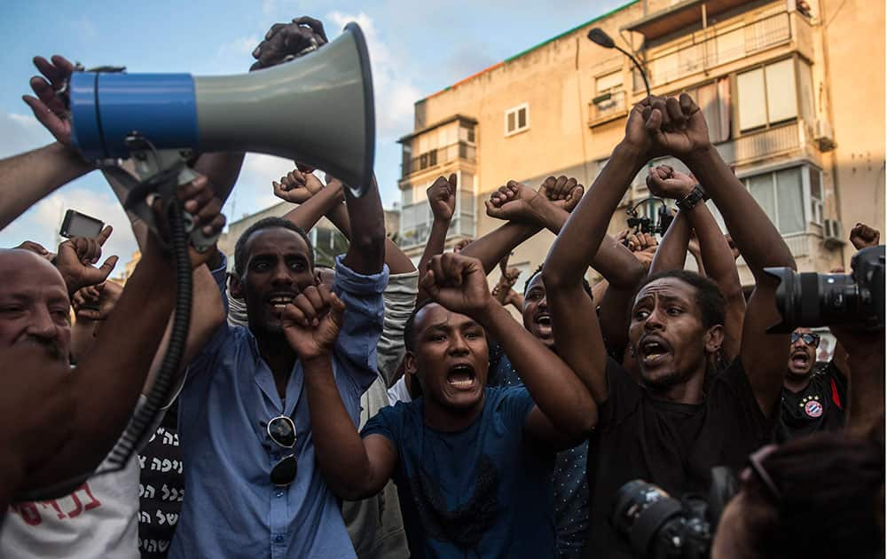 Ethiopian Jewish men chant during a protest in Tel Aviv, Israel.