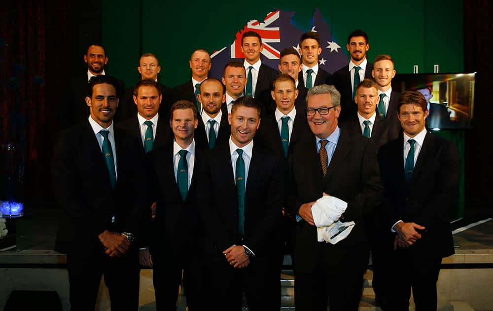 The 2015 Australian Cricket team pose with the Australian High Commissioner Alexander Downer, front center, next to the captain Michael Clarke, during a welcome party at the Australian High Commission in London.