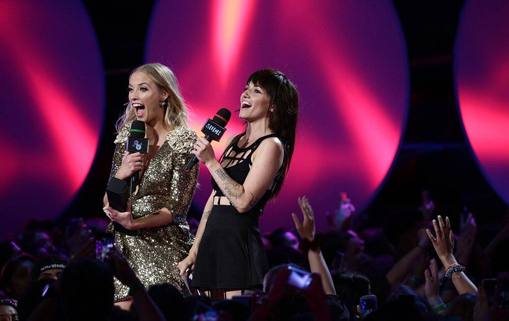 Liz Trinnear, left, and Lights appear at the 2015 MuchMusic Video Awards at the MuchMusic HQ, in Toronto, Canada.