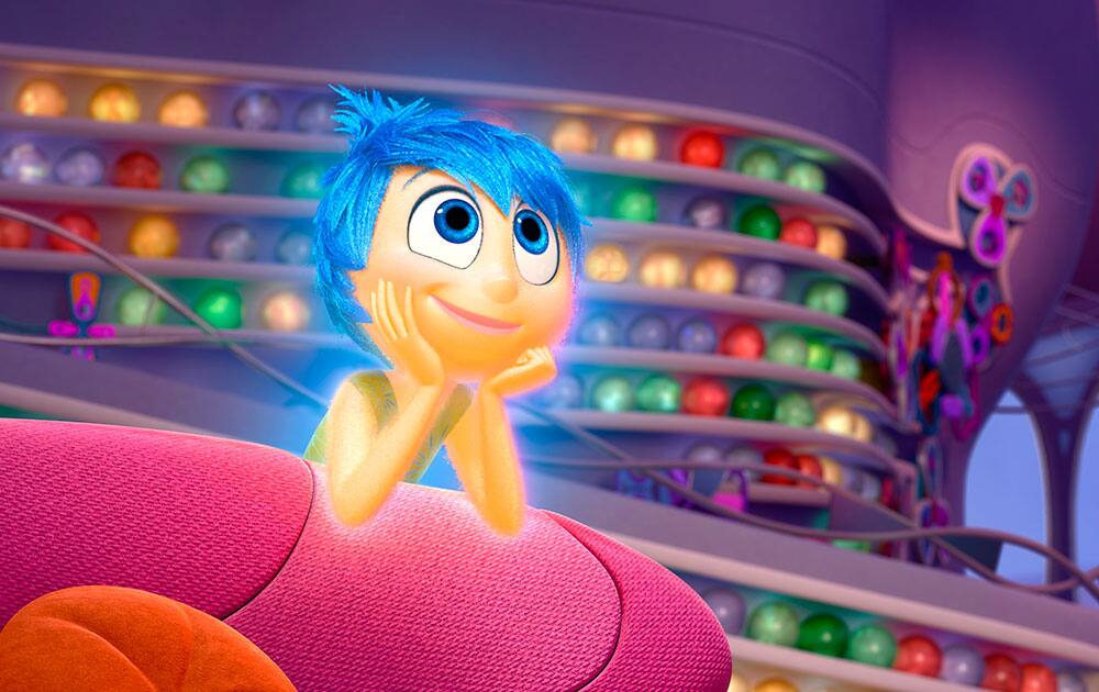 In this image released by Disney-Pixar, the character Joy, voiced by Amy Poehler, appears in a scene from 