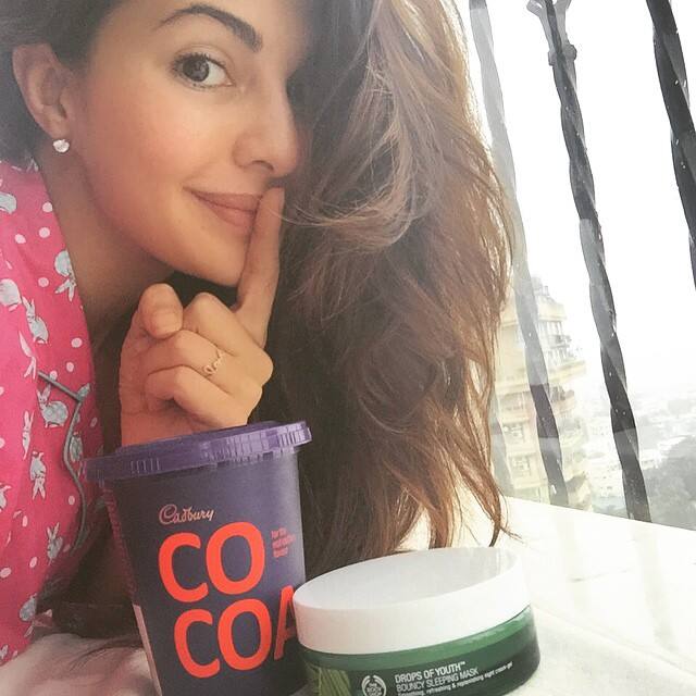 Jacqueline Fernandez :- Woo hoo! @thebodyshopindia #dropsofyouth #bouncysleepingmask is finally here!! Thanks for throwing in my fav #hotchocolate this calls for a #pyjamaparty -instagram