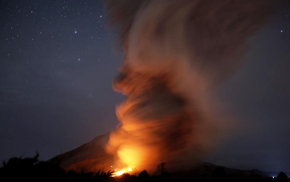 Mount Sinabung spews pyroclastic flows as seen from Tiga Kicat, North Sumatra, Indonesia. The volcano has been at the highest alert level since June 2.