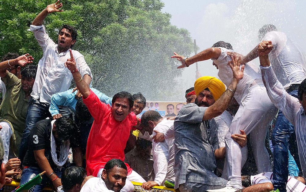 Delhi BJP workers protesting outside the Vidhan Sabha on the first day of its monsoon session in New Delhi.