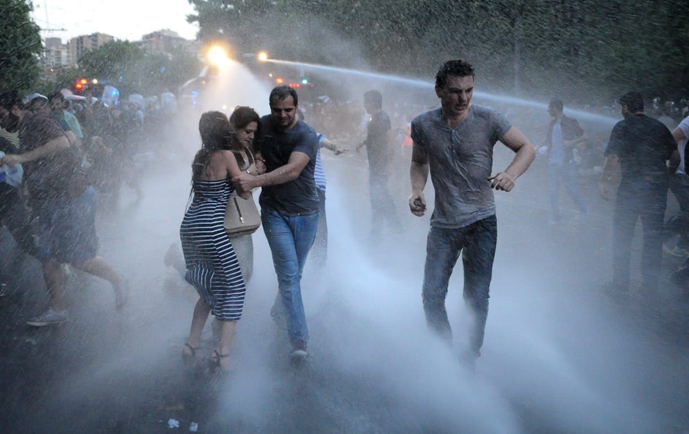 Armenian police use water cannons to disperse protesters demonstrating against an increase in electricity prices in the Armenian capital of Yerevan.