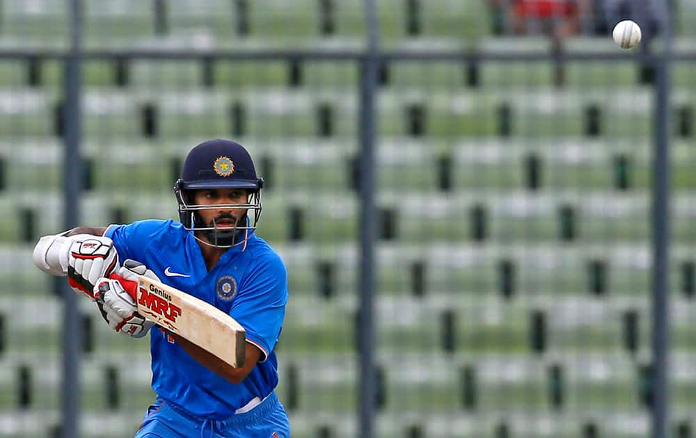 Shikhar Dhawan plays a shot during their third one-day international cricket match against Bangladesh in Dhaka.