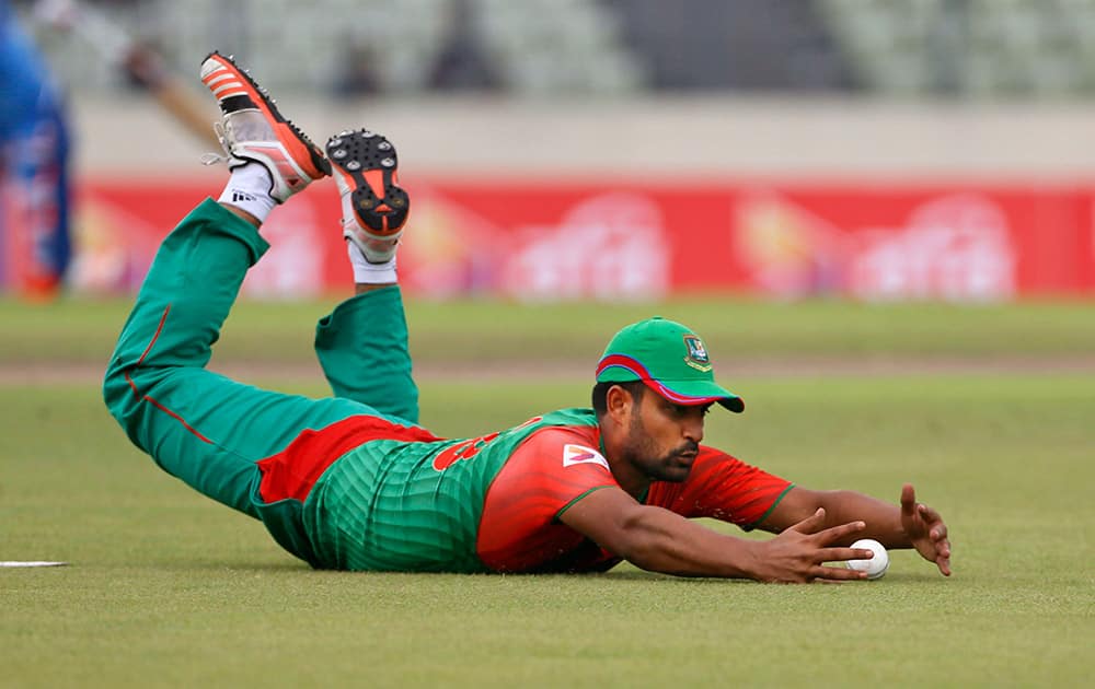 Tamim Iqbal dives to stop the ball as he fields against India during their third one-day international cricket match in Dhaka.