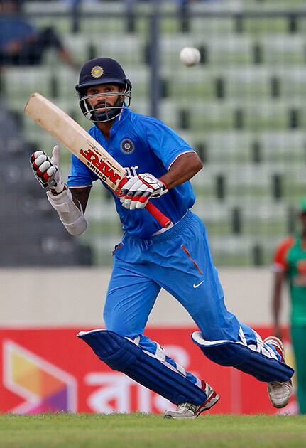 Shikhar Dhawan plays a shot during their third one-day international cricket match against Bangladesh in Dhaka.