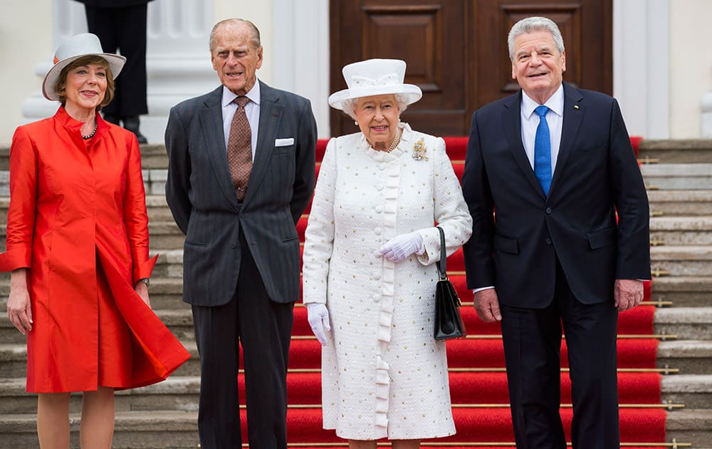 Britain's Queen Elizabeth II, second from right, and Prince Philip, the Duke of Edinburgh, second from left, are welcomed by German President Joachim Gauck, right, and his partner Daniela Schadt in front of Bellevue Palace in Germany's capital Berlin.