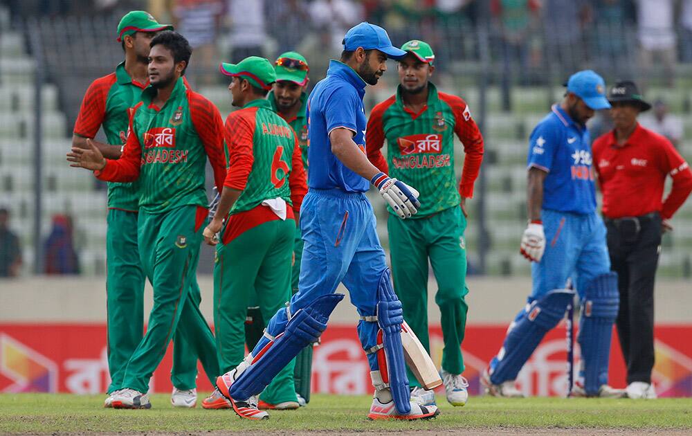 Virat Kohli walks back to the pavilion after his dismissal by Bangladesh’s Shakib Al Hasan during the third one-day international cricket match between them in Dhaka.