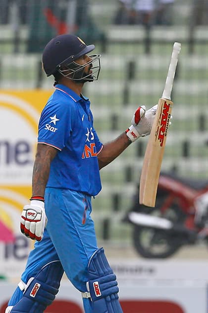 Shikhar Dhawan reacts as he walks back to the pavilion after his dismissal by Bangladesh’s captain Mashrafe Mortaza during their third one-day international cricket match in Dhaka.