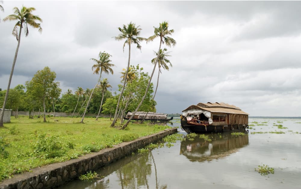 Houseboat in backwaters on a cloudy day