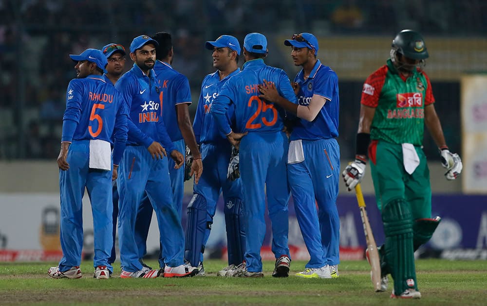 Indian players celebrate the dismissal of Bangladesh’s Soumya Sarkar during their third one-day international cricket match in Dhaka.