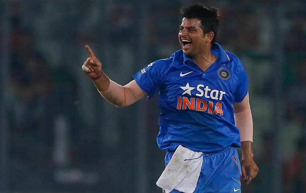 Suresh Raina, celebrates after the dismissal of Bangladesh’s Mushfiqur Rahim during their third one-day international cricket match in Dhaka.