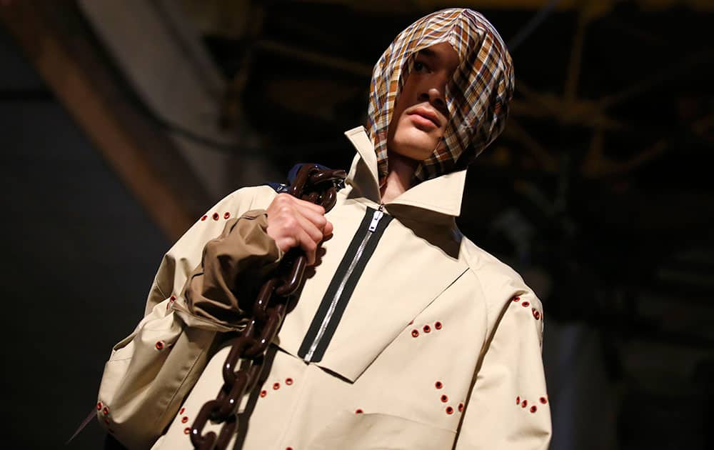 A model wears a creation by Belgian fashion designer Raf Simons, as part of his men's Spring/Summer 2016 fashion collection, during Mode a Paris, presented in Paris, France.