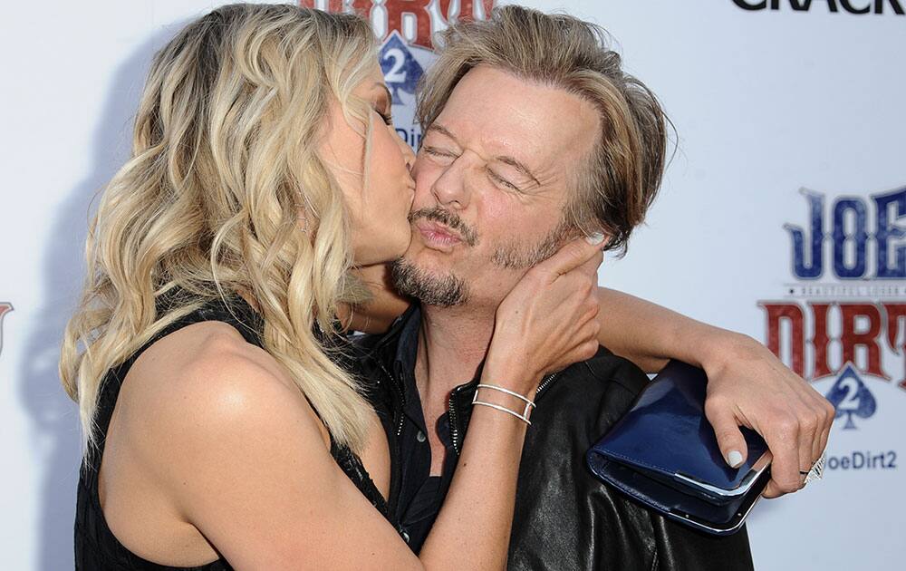 Brittany Daniel and David Spade kiss at the LA Premiere of 