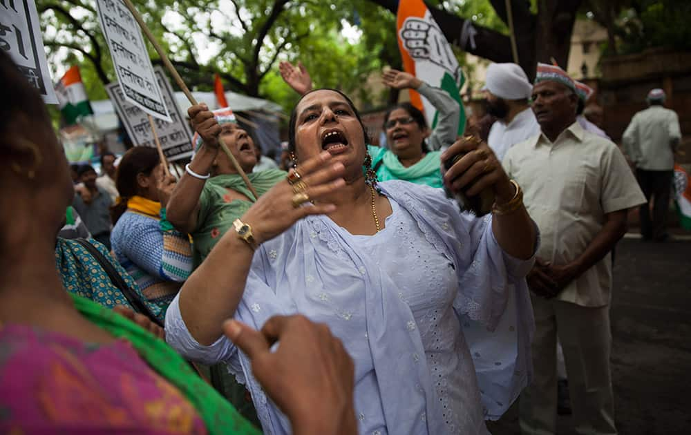 A supporter of Congress party shouts slogans during a protest against Minister for Human Resource Development Smriti Irani in New Delhi.