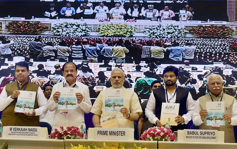 PM Narendra Modi with Union Urban Development Minister Venkaiah Naidu, MoS Babul Supriyo, Mahrashtra CM Devendra Fadnavis, and Haryana CM M L Khattar in New Delhi.