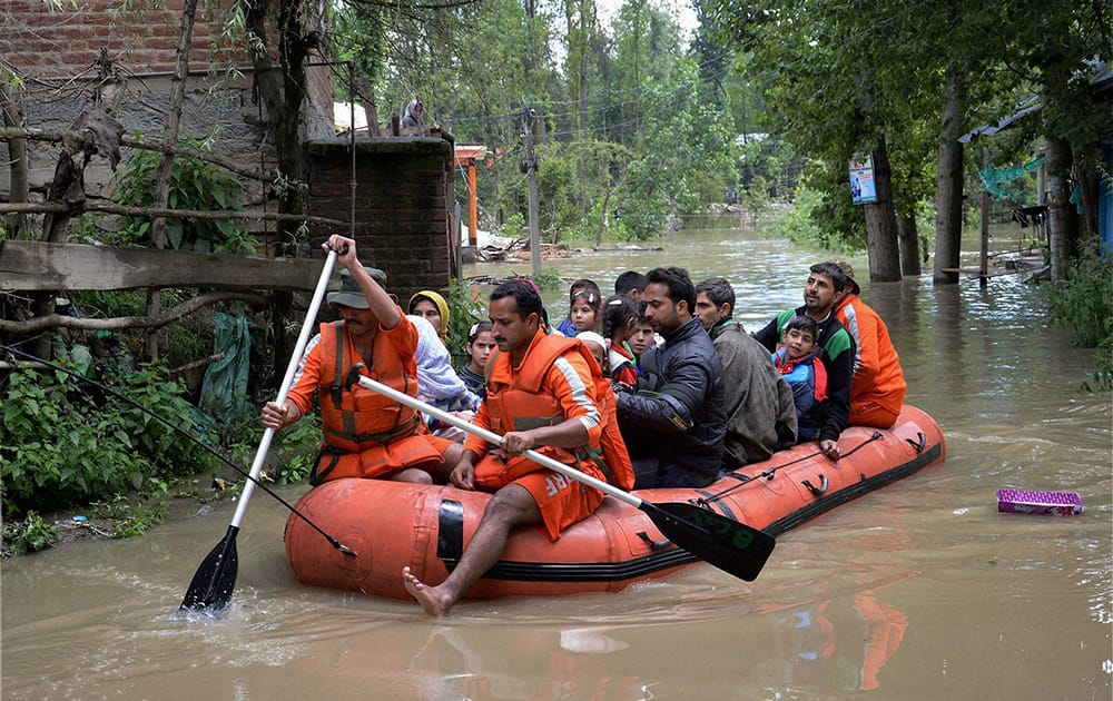NDRF Personnel rescues trapped families from the flood hit Aadur Urhanhal Mandi area of Anantnag District of South Kashmir.