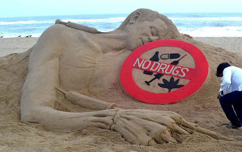 Sand artist Sudarsan Pattnaik creates a sand sculpture with message No Drugs at Puri beach of Odisha on Thursday on the occasion of international day against drug abuse and illicit trafficking.