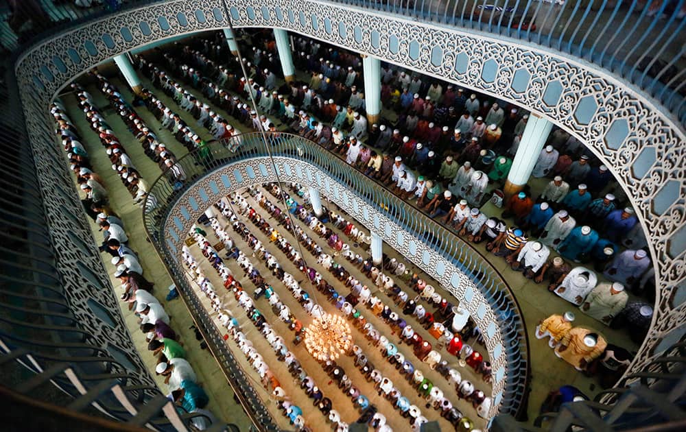 Bangladeshi Muslims attend Friday prayers at Baitul Mukaram national mosque during the Islamic holy month of Ramadan in Dhaka, Bangladesh.