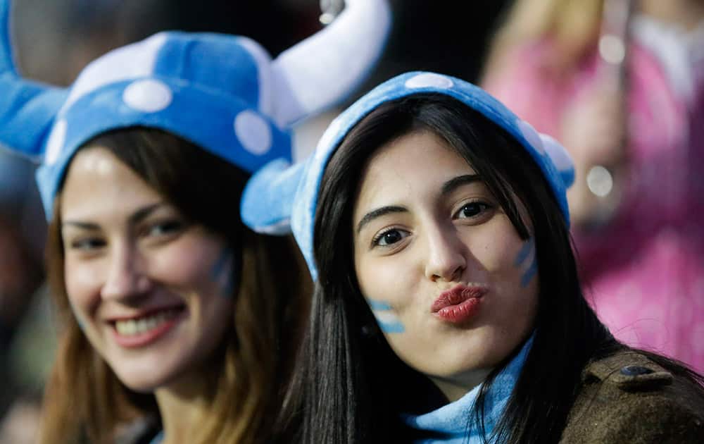 Argentina's fans pose before the start of a Copa America quarterfinal soccer match between Argentina and Colombia at the Sausalito Stadium in Vina del Mar, Chile.