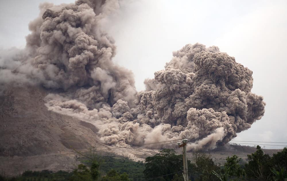 Mount Sinabung releases pyroclastic flows as seen from Tiga Serangkai, North Sumatra, Indonesia.