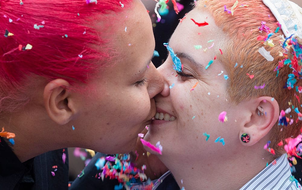 Stacey Allen, left, and Sean Allen kiss after they were married at Fountain Square, in Cincinnati, after the Supreme Court declared that same-sex couples have a right to marry anywhere in the United States. Ohio was one of 14 states enforcing a ban on same-sex marriage. 