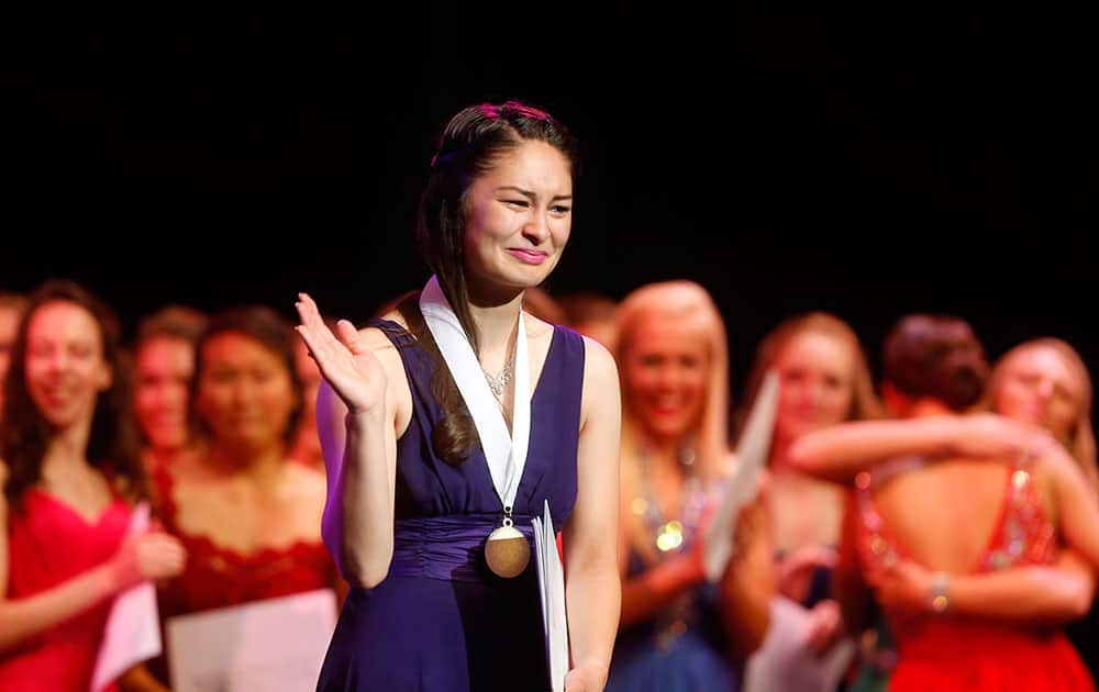 Alaska's Maire Nakada gestures after being named the Distinguished Young Woman of America for 2015 during the 58th National Finals, in Mobile, Ala.